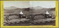 335 - Building Water Tank. Trout Creek Mountains in Distance